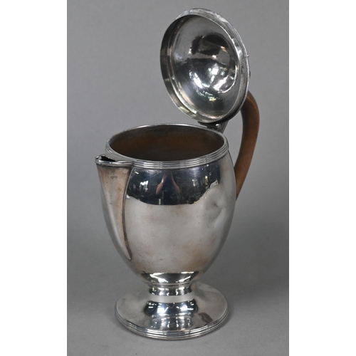 67 - A George III silver chocolate pot of ovoid form, the domed lid with urn finial, carved wood handle, ... 