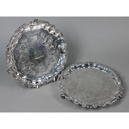 69 - A pair George III silver salvers with shell and scroll moulded rims, later foliate engraved decorati... 