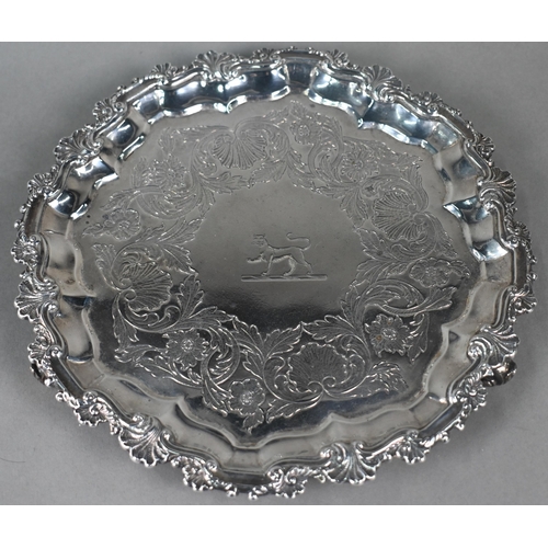 69 - A pair George III silver salvers with shell and scroll moulded rims, later foliate engraved decorati... 