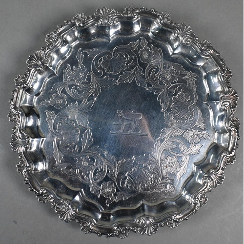 69 - A pair George III silver salvers with shell and scroll moulded rims, later foliate engraved decorati... 