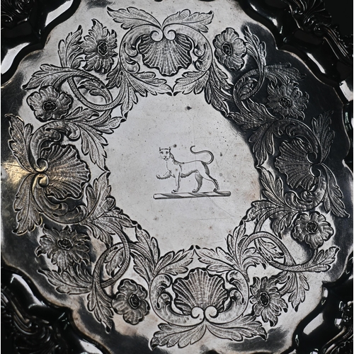 69 - A pair George III silver salvers with shell and scroll moulded rims, later foliate engraved decorati... 