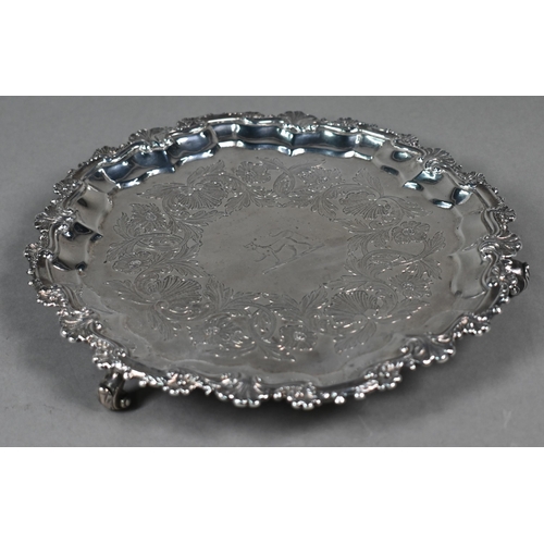 69 - A pair George III silver salvers with shell and scroll moulded rims, later foliate engraved decorati... 