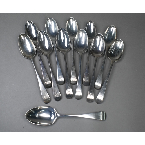 77 - A matched set of twelve mid Georgian Old English pattern silver tablespoons - various makers and dat... 