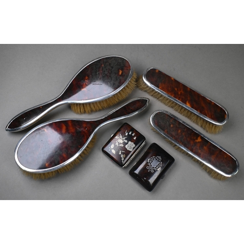 79 - Two pairs of silver and tortoiseshell brushes, Birmingham 1922, to/w two piqué-work coin purses (6)