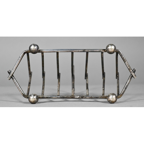 8 - A Victorian electroplated toast rack of triangular form, in the manner of Christopher Dresser, stamp... 