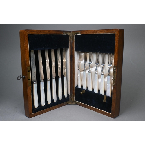 82 - A set of twelve silver dessert knives and forks with mother of pearl handles, C.W. Fletcher & So... 