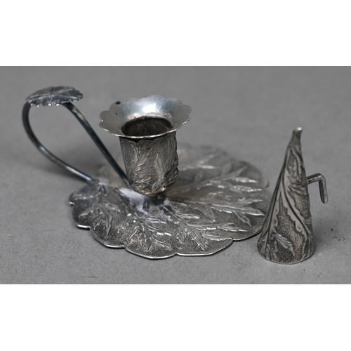 84 - An early Victorian miniature chamber-taperstick with chased foliate decoration, c/w conical snuffer,... 