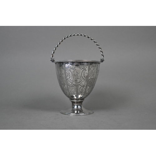 87 - A George III silver sucrier of ovoid form with ropetwist swing handle and engraved decoration, on st... 