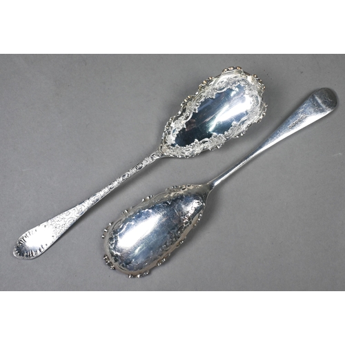 91 - A pair of Victorian silver serving spoons with engraved decoration and crenellated rims, Atkin Broth... 