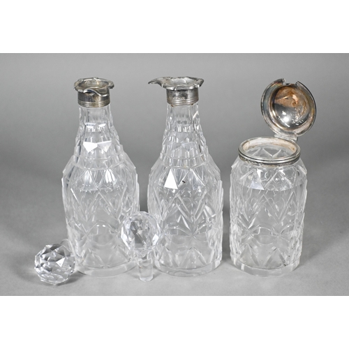 98 - Three Victorian cut glass condiment bottles with silver mounts, to/w a conical candle snuffer on tur... 