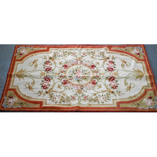 619 - A small Aubusson floral rug design rug, on camel ground, 149 cm x 89 cm