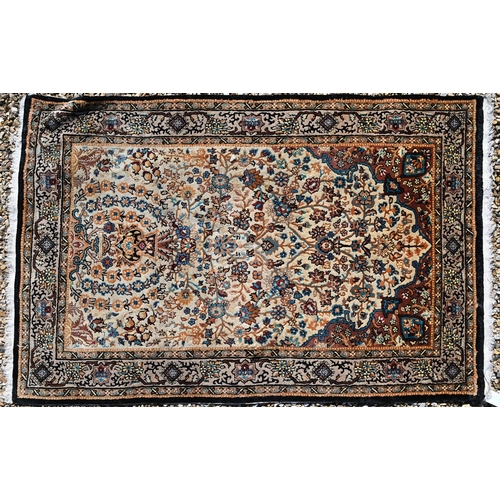 624 - A small fine Kashmir silk rug, the overall colourful floral design on camel ground, 97 cm x 62 cm