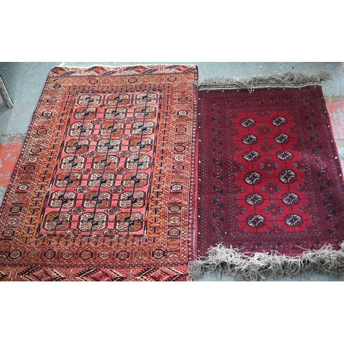 626 - An old Turkoman red ground rug, with three rows of geometric guls, 160 cm x 105 cm to/with a Pakista... 