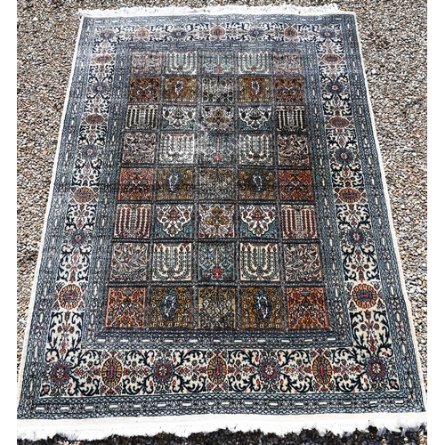 633 - An old Persian Baktiari garden tile design rug in multi-coloured silks, 185 cm x 121 cm