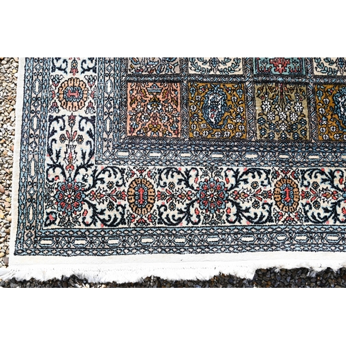 633 - An old Persian Baktiari garden tile design rug in multi-coloured silks, 185 cm x 121 cm