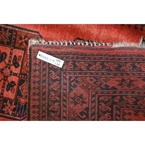 634 - An old Afghan pale red ground lozenge pole design rug, 220 cm x 133 cm, even wear, minor loss to end... 