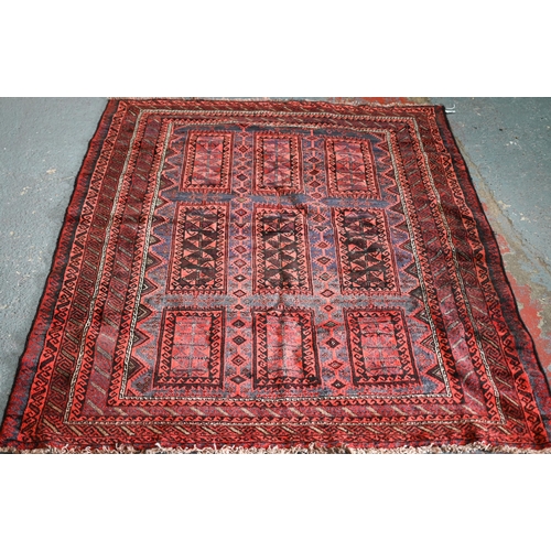 635 - An old Belouch rug, the field with geometric gul design, 190 cm x 150 cm