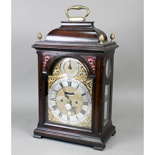 Jasper Taylor, Holborn, London, an 18th century walnut cased verge bracket clock, the twin fusee movement with fully engraved backplate, signed, striking the hours on a bell, the arched brass dial with gilt spandrels and silvered Roman numeral chapter ring enclosing a pendulum aperture, a date aperture and an applied signed silvered tablet, the arch with strike silent selector, the case with circular glazed panels and surmounted by a caddy top with folding handle and four brass pineapple finials, 45 cm h o/all