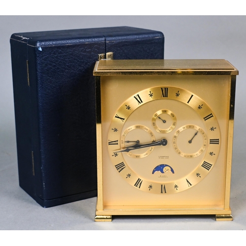 647 - A Swiss antimagnetic 8-day calendar alarm travel clock by Looping, the gilt-brass case with twin win... 