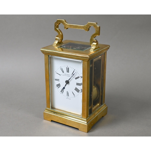 649 - A French lacquered brass 8-day carriage clock, the two train movement with white enamelled dial sign... 