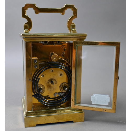 649 - A French lacquered brass 8-day carriage clock, the two train movement with white enamelled dial sign... 