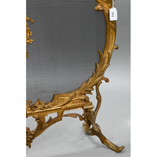 651 - A French rococo style gilt metal framed spark guard, with wire mesh panel on foliate scroll feet, 61... 