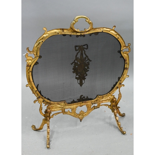 651 - A French rococo style gilt metal framed spark guard, with wire mesh panel on foliate scroll feet, 61... 