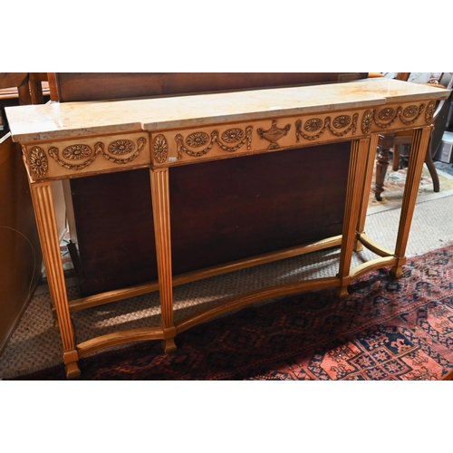 657 - An Adam style breakfront giltwood marble top console table, the frieze with floral swags in relief, ... 