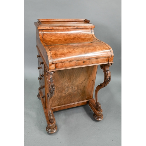 659 - A Victorian walnut piano top Davenport desk, the rise and fall stationary store over a hinged top en... 