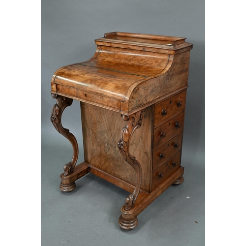 659 - A Victorian walnut piano top Davenport desk, the rise and fall stationary store over a hinged top en... 