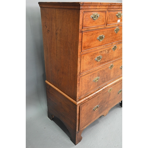 663 - A George I cross-banded walnut chest on stand, with three short over three long graduated drawers, t... 