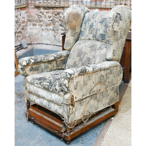 664 - A Foots of London, patent metamorphic reclining wingback armchairchair with integral two stage footr... 