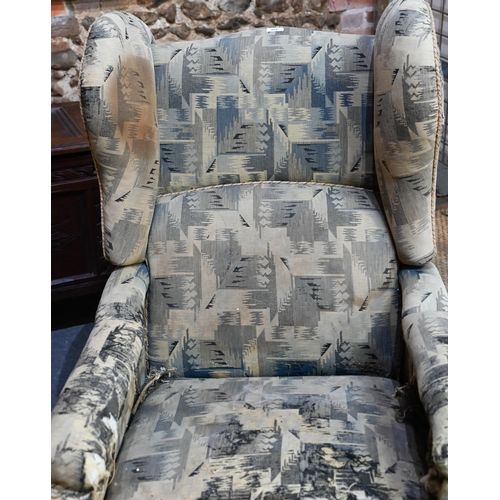 664 - A Foots of London, patent metamorphic reclining wingback armchairchair with integral two stage footr... 