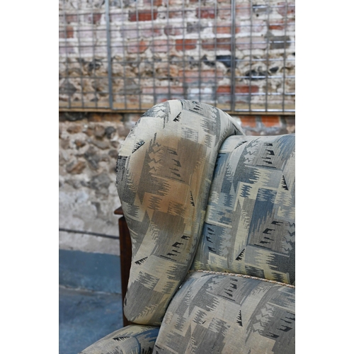 664 - A Foots of London, patent metamorphic reclining wingback armchairchair with integral two stage footr... 