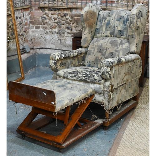 664 - A Foots of London, patent metamorphic reclining wingback armchairchair with integral two stage footr... 