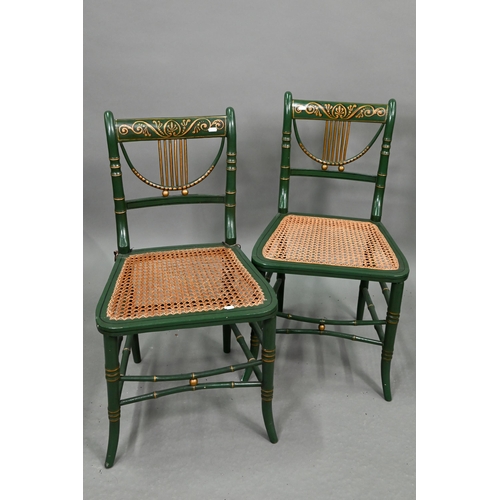 666 - A set of four Regency gilt and green painted faux bamboo salon side chairs, with caned seats (4)