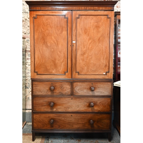 667 - A Victorian mahogany linen press, the moulded cornice over a pair of moulded panelled doors over two... 