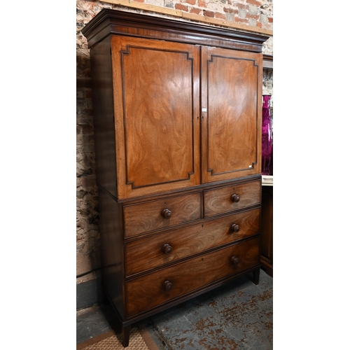 667 - A Victorian mahogany linen press, the moulded cornice over a pair of moulded panelled doors over two... 