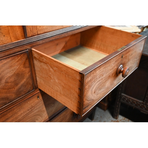 667 - A Victorian mahogany linen press, the moulded cornice over a pair of moulded panelled doors over two... 