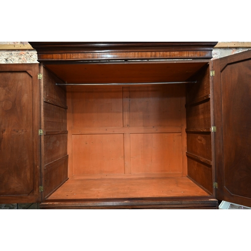 667 - A Victorian mahogany linen press, the moulded cornice over a pair of moulded panelled doors over two... 