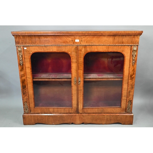 669 - A Victorian ormolu mounted crossbanded and boxwood inlaid walnut salon cabinet, the two arched glaze... 