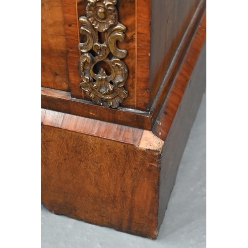 669 - A Victorian ormolu mounted crossbanded and boxwood inlaid walnut salon cabinet, the two arched glaze... 