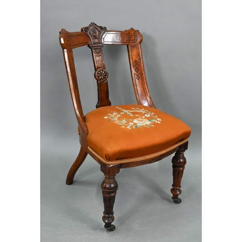 671 - A set of twelve Victorian oak and pollard oak dining chairs, with relief moulded armorial centred ba... 