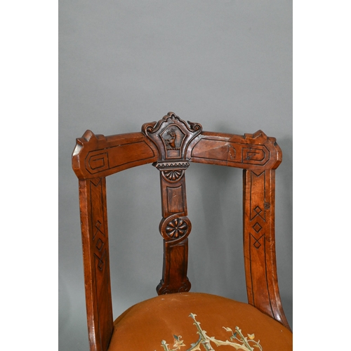 671 - A set of twelve Victorian oak and pollard oak dining chairs, with relief moulded armorial centred ba... 