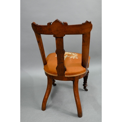 671 - A set of twelve Victorian oak and pollard oak dining chairs, with relief moulded armorial centred ba... 