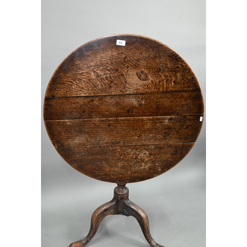 674 - An 18th century oak tripod table, the circular tilt top over a moulded support, 78 cm dia. x 70 cm h