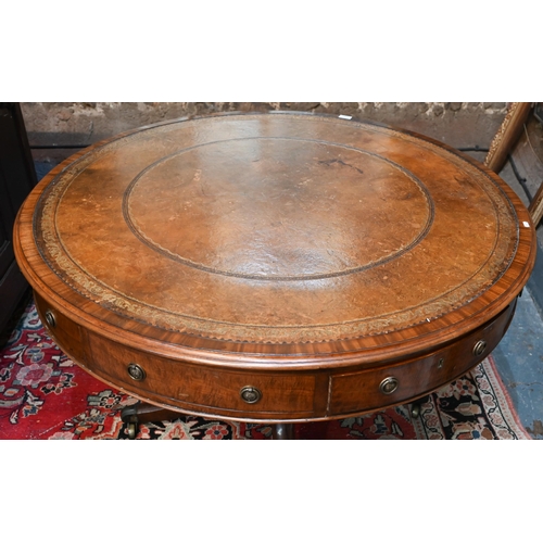 675 - A Victorian mahogany library drum table, the gilt tooled tan leather inset revolving top with four a... 