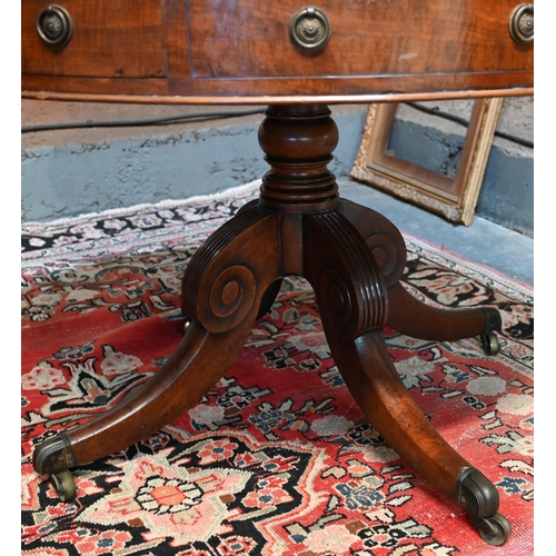 675 - A Victorian mahogany library drum table, the gilt tooled tan leather inset revolving top with four a... 