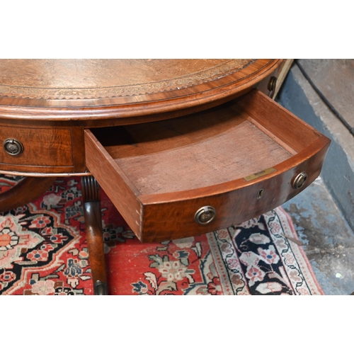 675 - A Victorian mahogany library drum table, the gilt tooled tan leather inset revolving top with four a... 