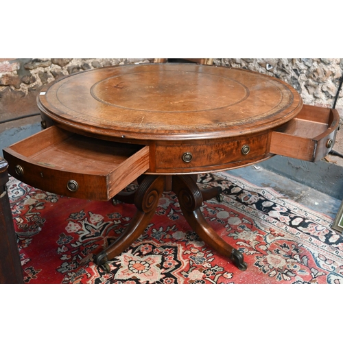 675 - A Victorian mahogany library drum table, the gilt tooled tan leather inset revolving top with four a... 